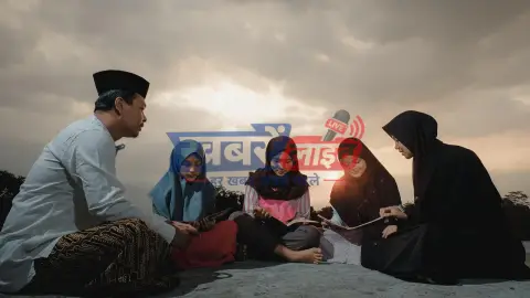 JEE Main – छात्र लैपटॉप और किताबों के साथ परीक्षा की तैयारी करते हुए